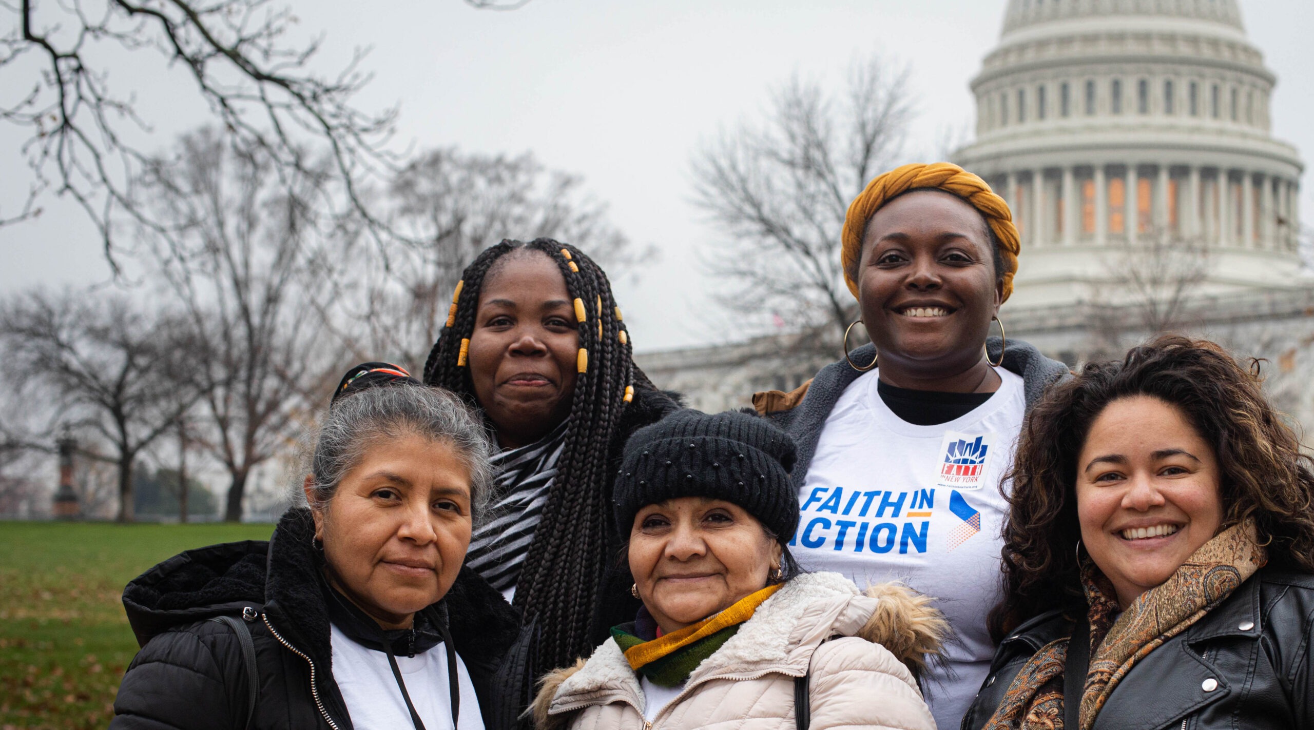 group of adults outdoors in front of the capital in late fall